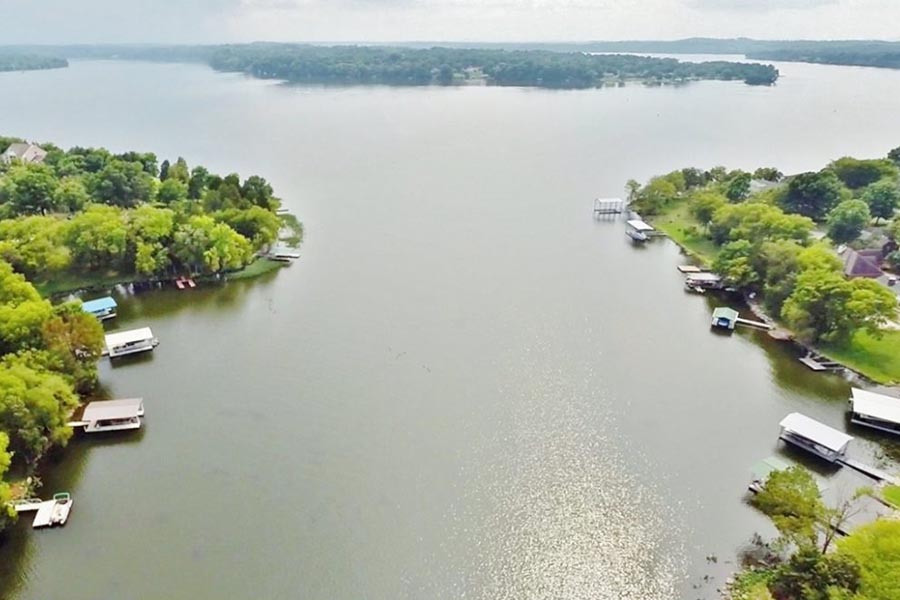 About Our Agency - Cumberland River Seen From Above, Trees on Each Bank, the Sky Hazy